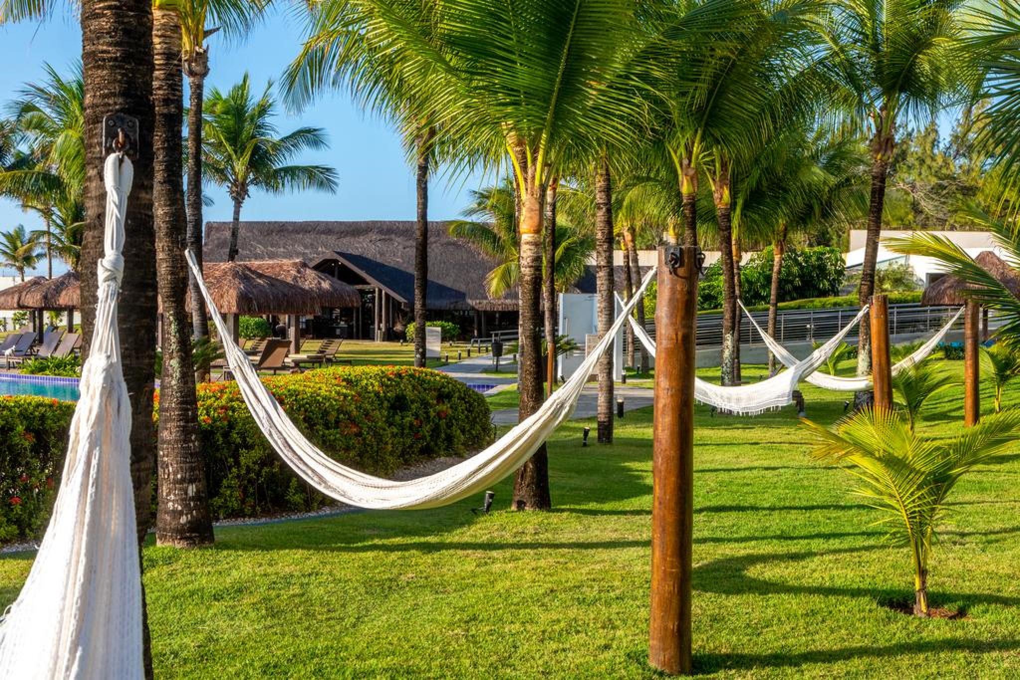 Отель Wish Натал Экстерьер фото Hammocks in a resort in Brazil
