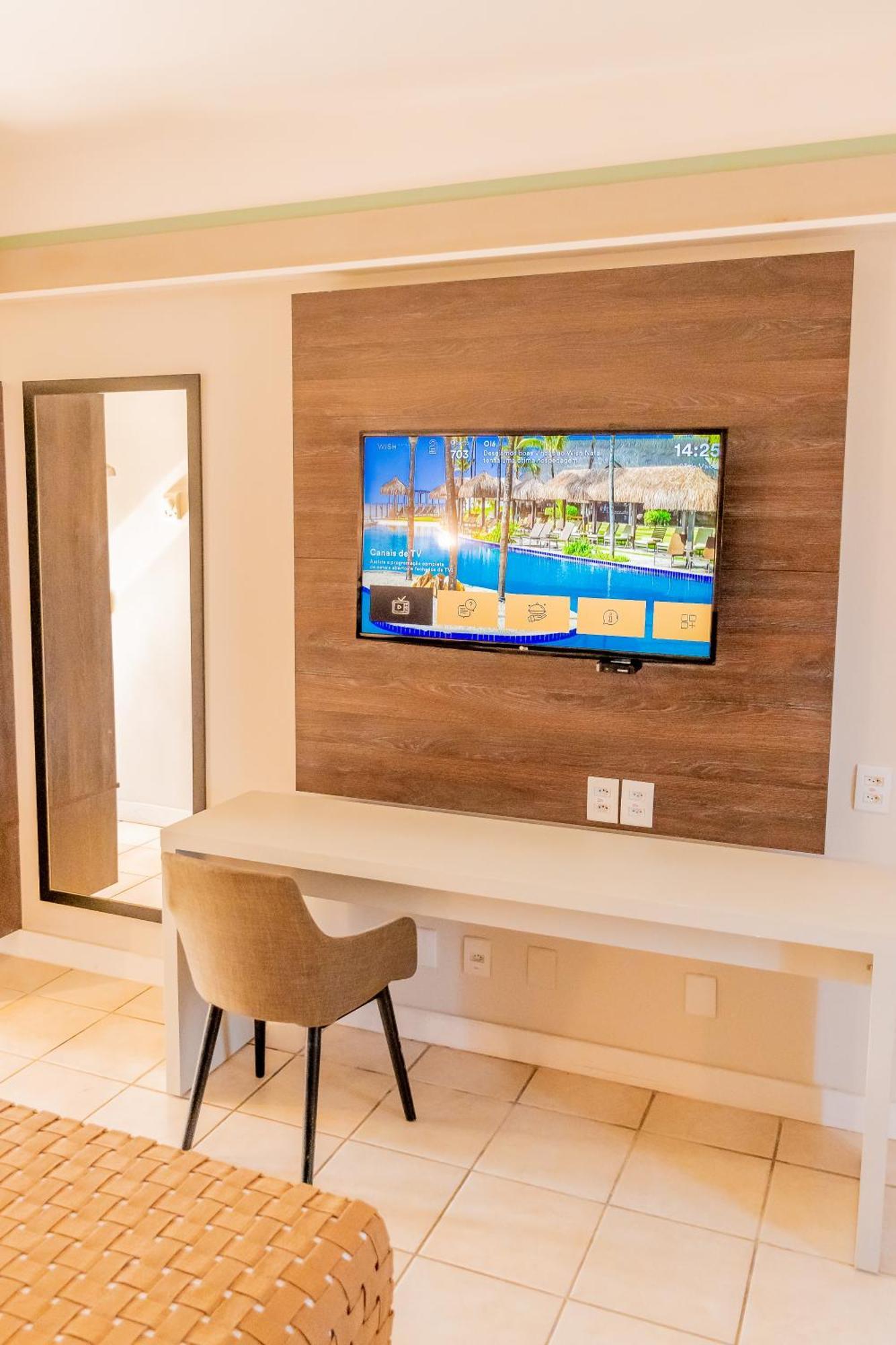 Отель Wish Натал Экстерьер фото A television in a hotel room